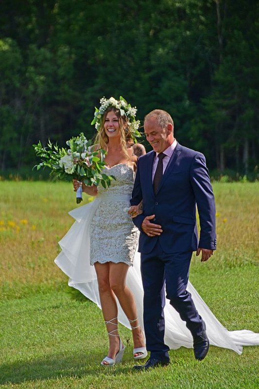 Dad walking his daughter down the 'aisle'