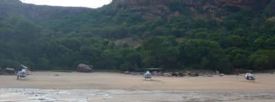 Prince Frederick Harbour,   Helicopters on beach for trip to Mitchell Falls 