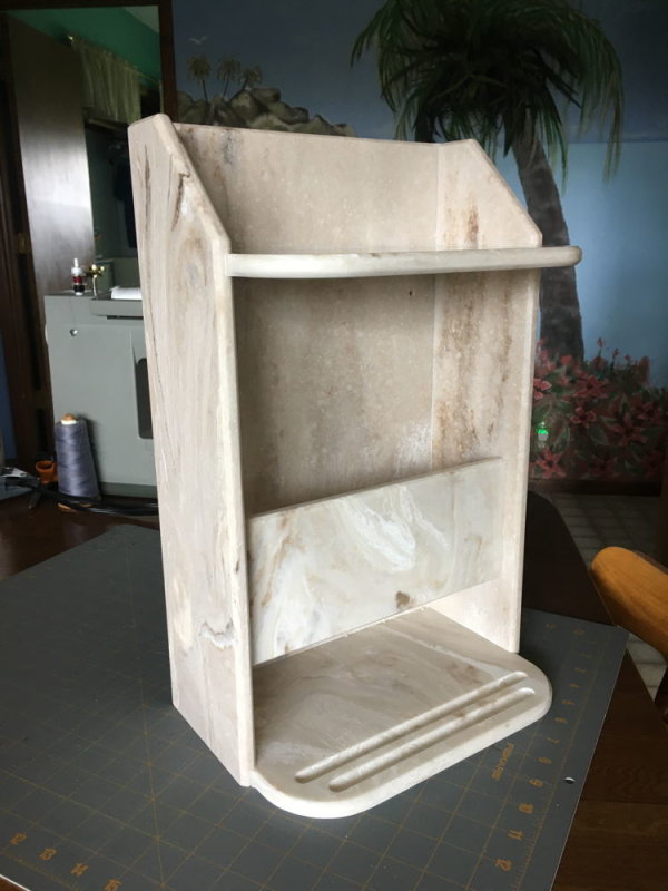 Shelf/magazine holder from left over solid surface
