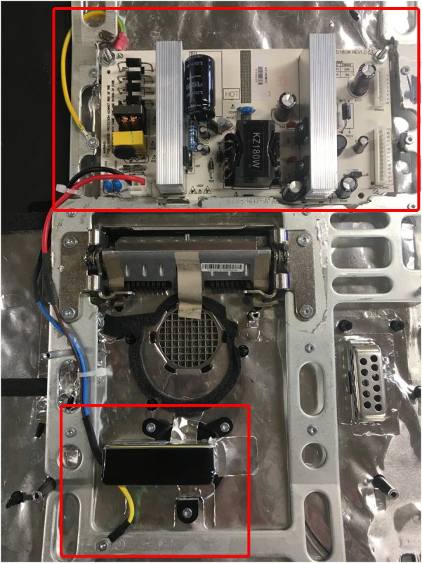 Gutted iMac, upper section is where the hard drive was located; Lower box is the original 120VAC connection