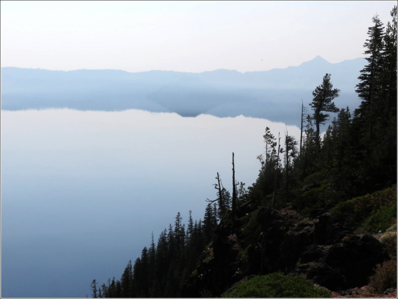 Smoke - we can see the reflection of Wizard Island, but not the island itself