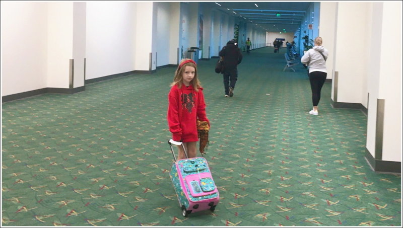 0010B-Ph - Miss T with her roller bag - So cute!