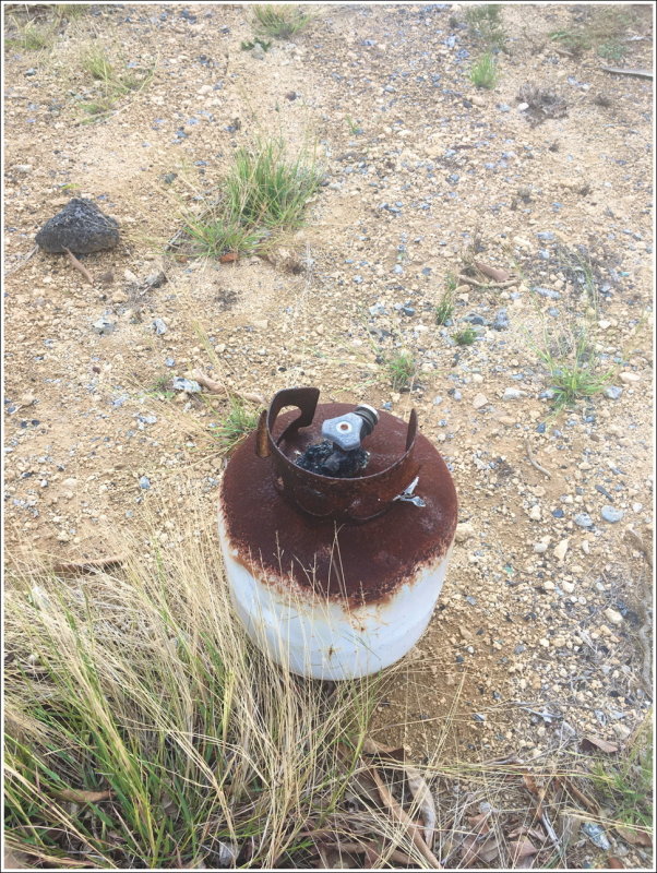 0420B-Ph - Uh, what happened to this propane bottle?  Looks like it was not good!