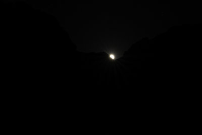 The Moon (24 hours past Full) made a very low pass across the sky, peeking through a notch in the cliffs opposite the river