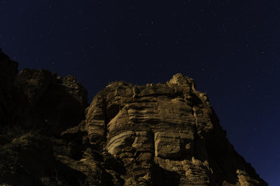 Moonlit cliff and stars