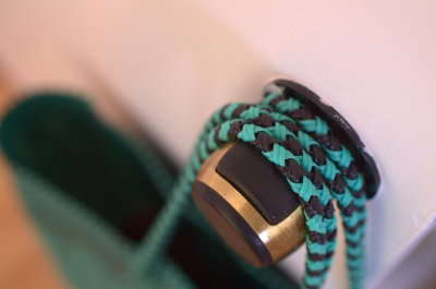 A bag hanging from a door knob