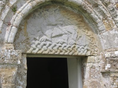 Dragon Carved in Stone above a door at the Historic Penmon Priory