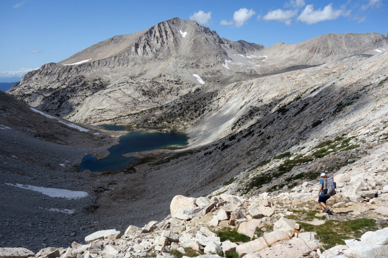 Descending north from White Bear Lake Pass over some rough loose boulders and scrub- we were glad to get down to easier ground