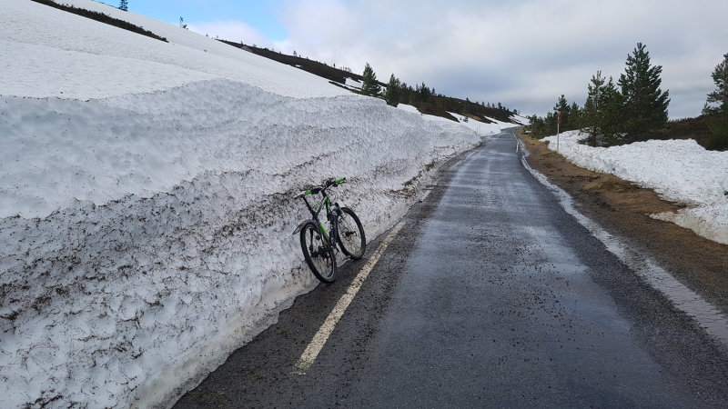 Feb 21 Cairngorms- cycling up to the ski car park with tthe road being closed to cars- plenty of snow!