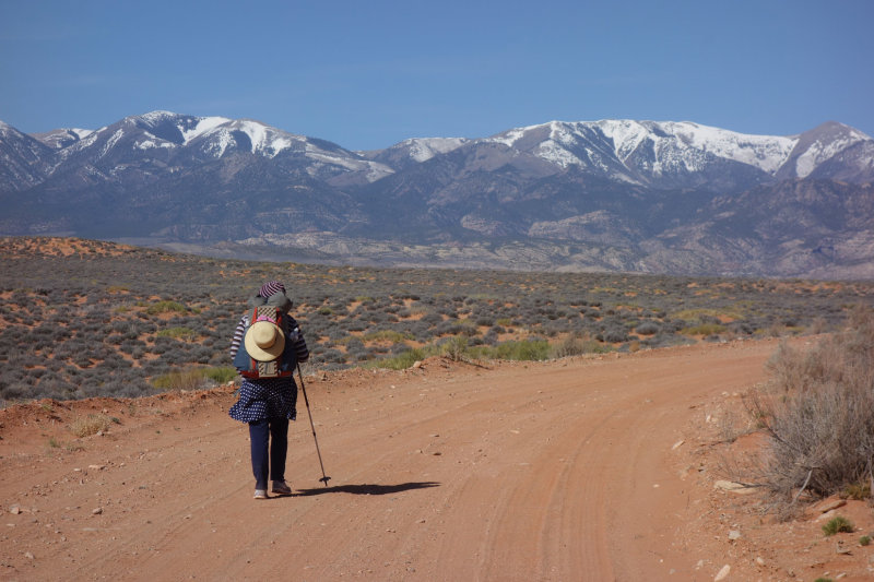 final hike out to Highway 95 with snowy Henry Mountains beyond