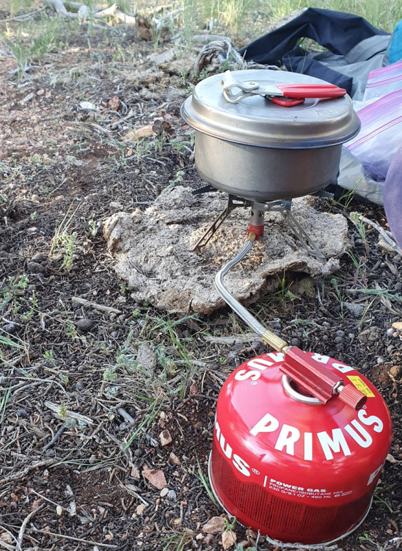 using a 'cow pat' as a base for the stove worked well!