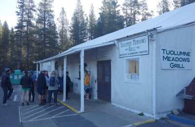Day 5 We camped at Toulumne Meadows. This the grill and Martina is first in the queue for breakfast!