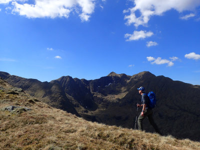 Brian - striding out! - with Ladhar Bheinn above
