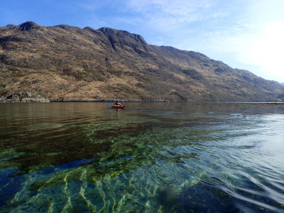 Calm clear water in Loch Hourn in the morning