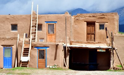 Adobe building with ladders at Taos Pueblo, Taos Mountain, New Mexico 393 
