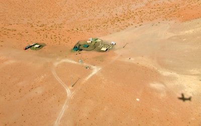Quest Kodiak airplane flying over Bedouin sheep camp, West Huraymila, Saudi Arabia 1139 