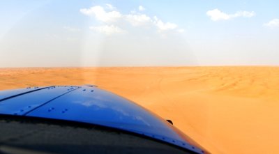 Quest Kodiak airplane flying over sea of sand dunes by Al Ghat, Riyadh Region, Saudi Arabia 1721 