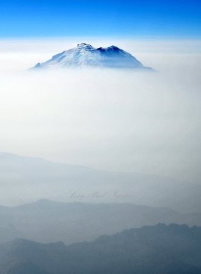 Mount Rainier and Little Tahoma shrouded in smoke at 14000 feet, Washington 141  