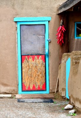 Taos Pueblo or Pueblo de Taos, North House door and chilli, New Mexico 420   