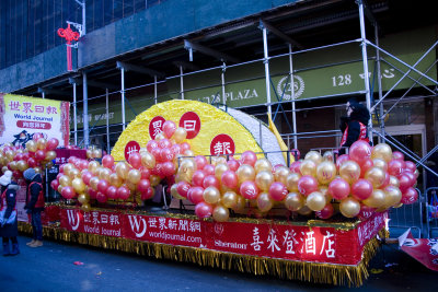 Many balloons on this colorful float