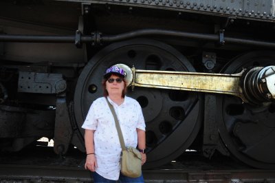 Michelle in front of a wheel of the Big Boy