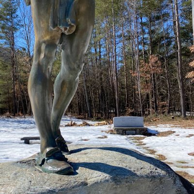 A little girl clinging to the bronze statue of an Indian Mar 2021
