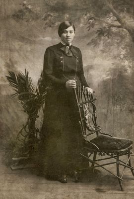 Lady posing by an Interesting Chair