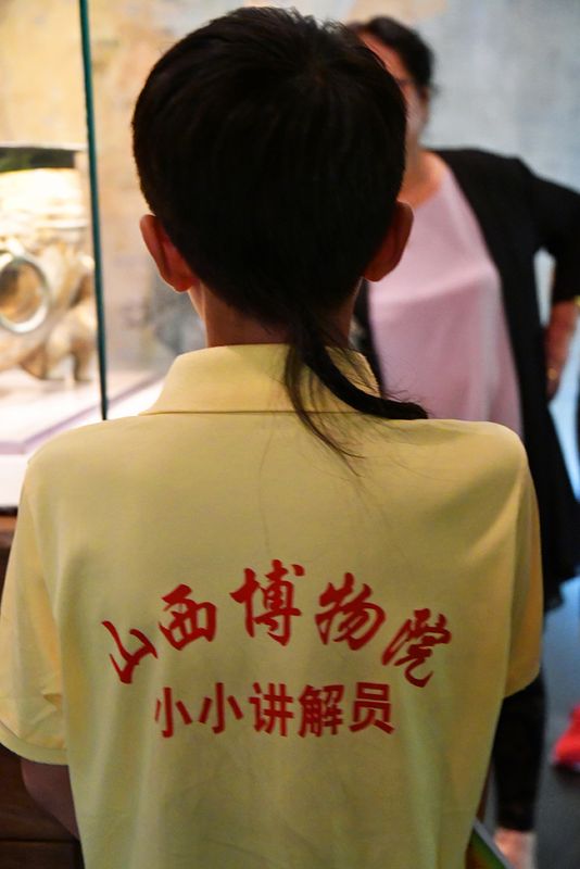 20_Our museum guide calmly answering questions.jpg