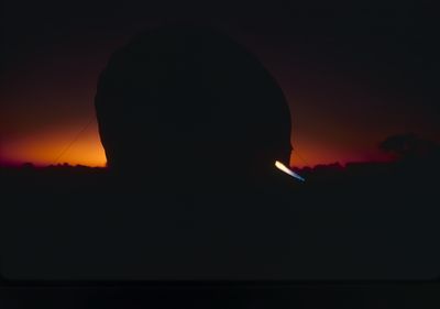 Inflating a hot air balloon at sunrise