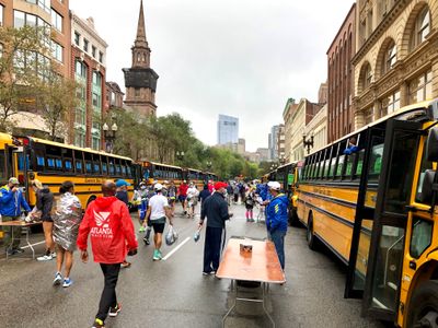 Since 2013, bags are checked in on buses at the finish line, instead of at Hopkinton (2021)