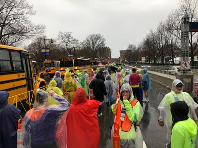 Loading up buses on Charles Street for drive to Hopkinton (2019)