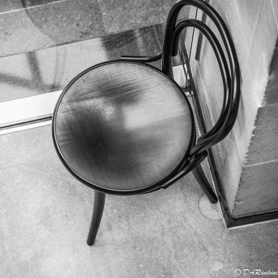 Reflection in a Black Chair