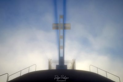 Mt Soledad cross back-lit in the fog