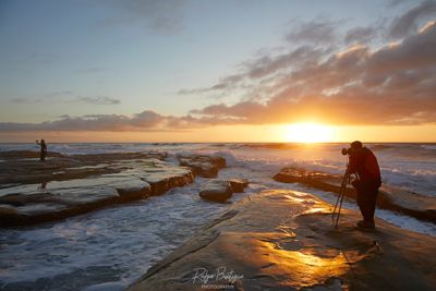 photographer photographing the sunset in La Jolla