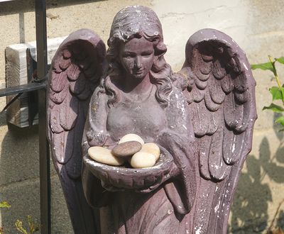 Mauve angel sculpture.