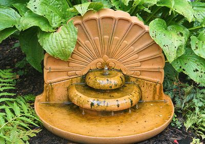 Terracotta shell fountain.