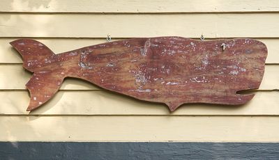 Wooden whale hanging.