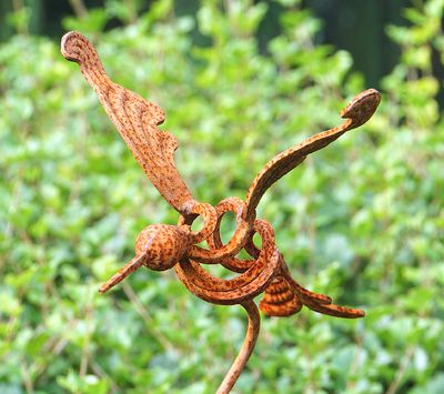 Rusty mosquito sculpture.