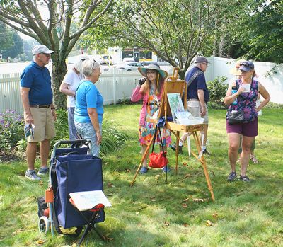 Artist Denise Brown with visitors.