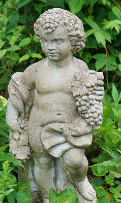 Boy with grapes sculpture.