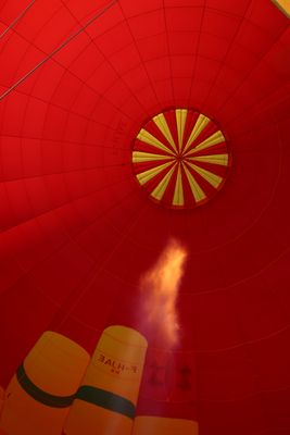 The burner heats the air in the balloon.
