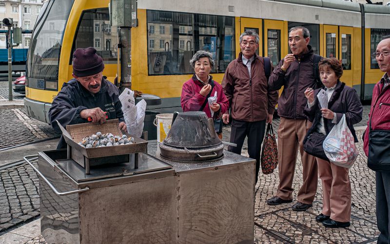 Tourists Eating Chestnuts