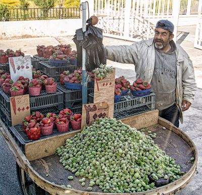 Vendor of Strawberries and Olives