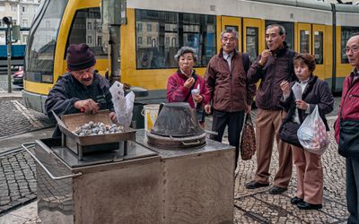 Tourists Eating Chestnuts