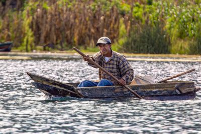 Mayan Fisherman in Avocado Wood Boat