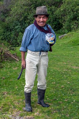 Quechua Farmer Picking up Litter