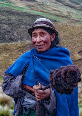 Quechua Shepherdess Spinning Llama Wool into Thread
