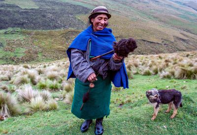 Quechua Shepherdess Spinning Llama Wool into Thread