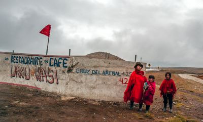 Quechua Sisters with Restaurant Sign