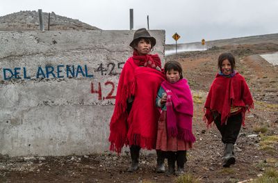 Quechua Sisters with Sign